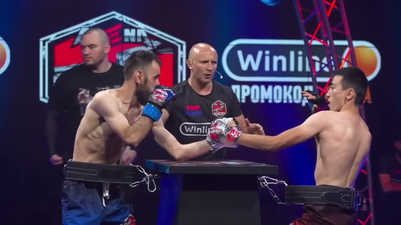 Russian Fighters Tape 1 Arm to Each Other & Throw Punches Across a Table in New Sport