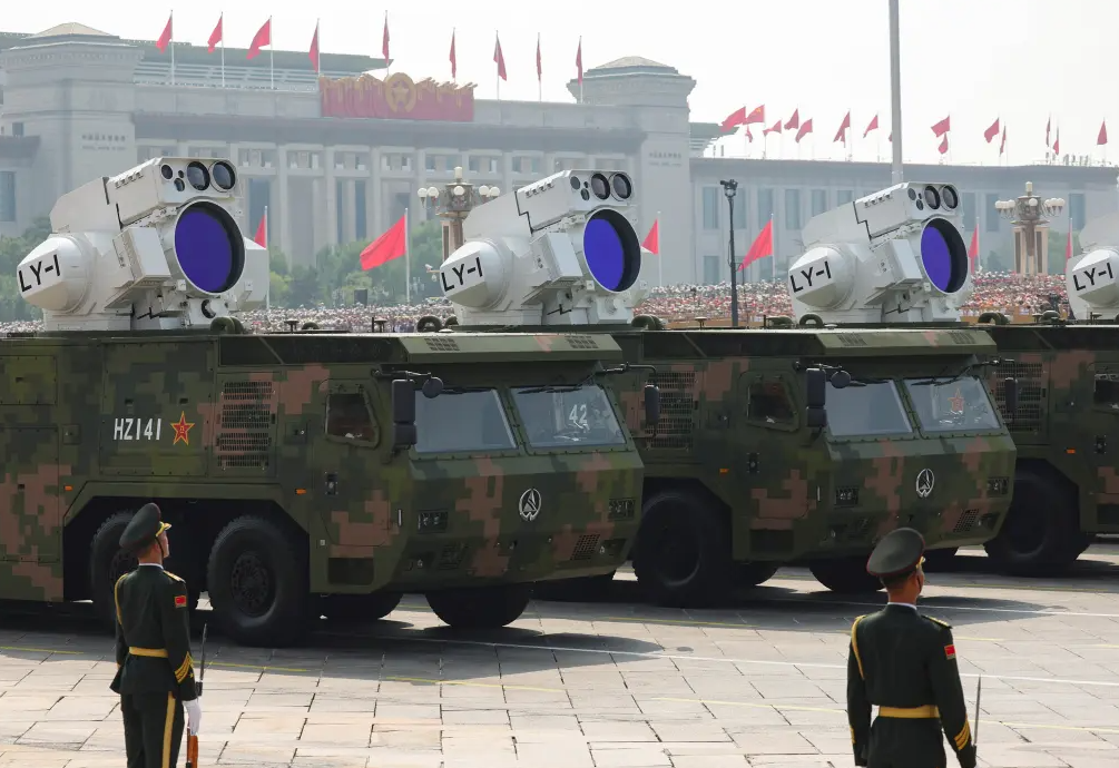 Putin and Kim join Xi in show of strength as China unveils new weapons at huge military parade
